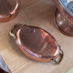 Wee copper stainless soufflé dish w brass handles on both sides. New Never used